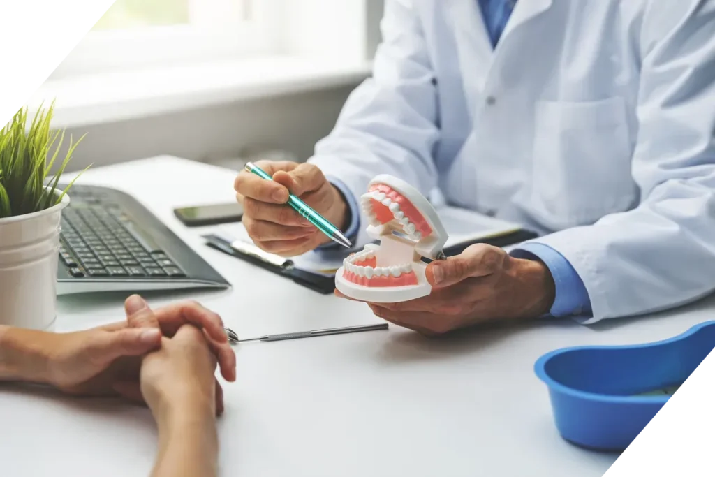 Dentist consulting with patient