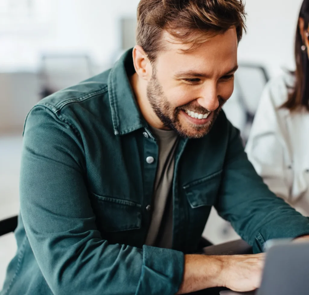 Successful Business Man Using A Laptop In