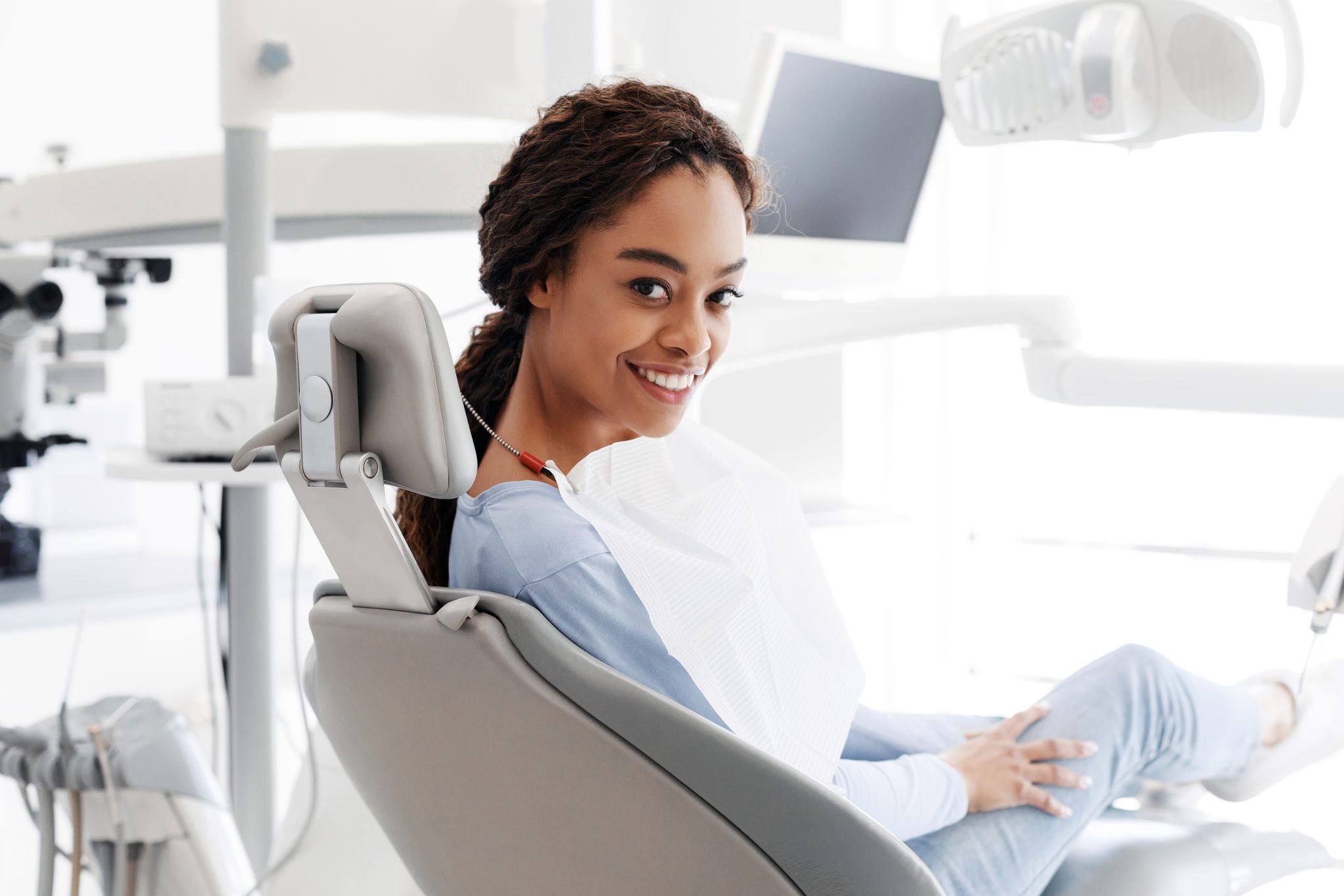 Cheerful Black Woman Sitting In Dentist Chair 1252685096 6396x4265 1