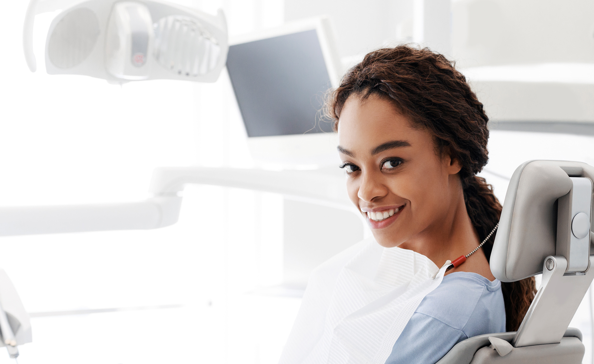 Cheerful Black Woman Sitting In Dentist Chair